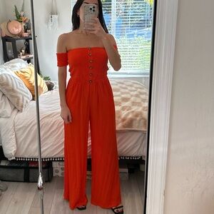 Venus strapless orange jumpsuit with smocked off-the-shoulder sleeves